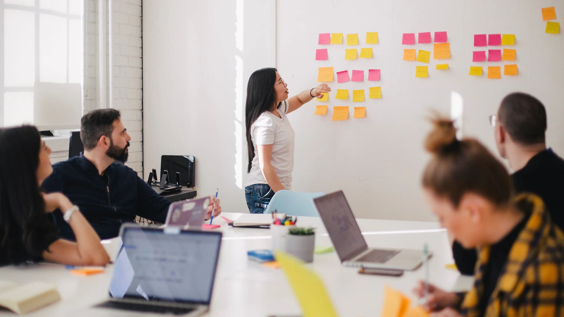 Brand strategists reviewing ideas during a collaborative workshop