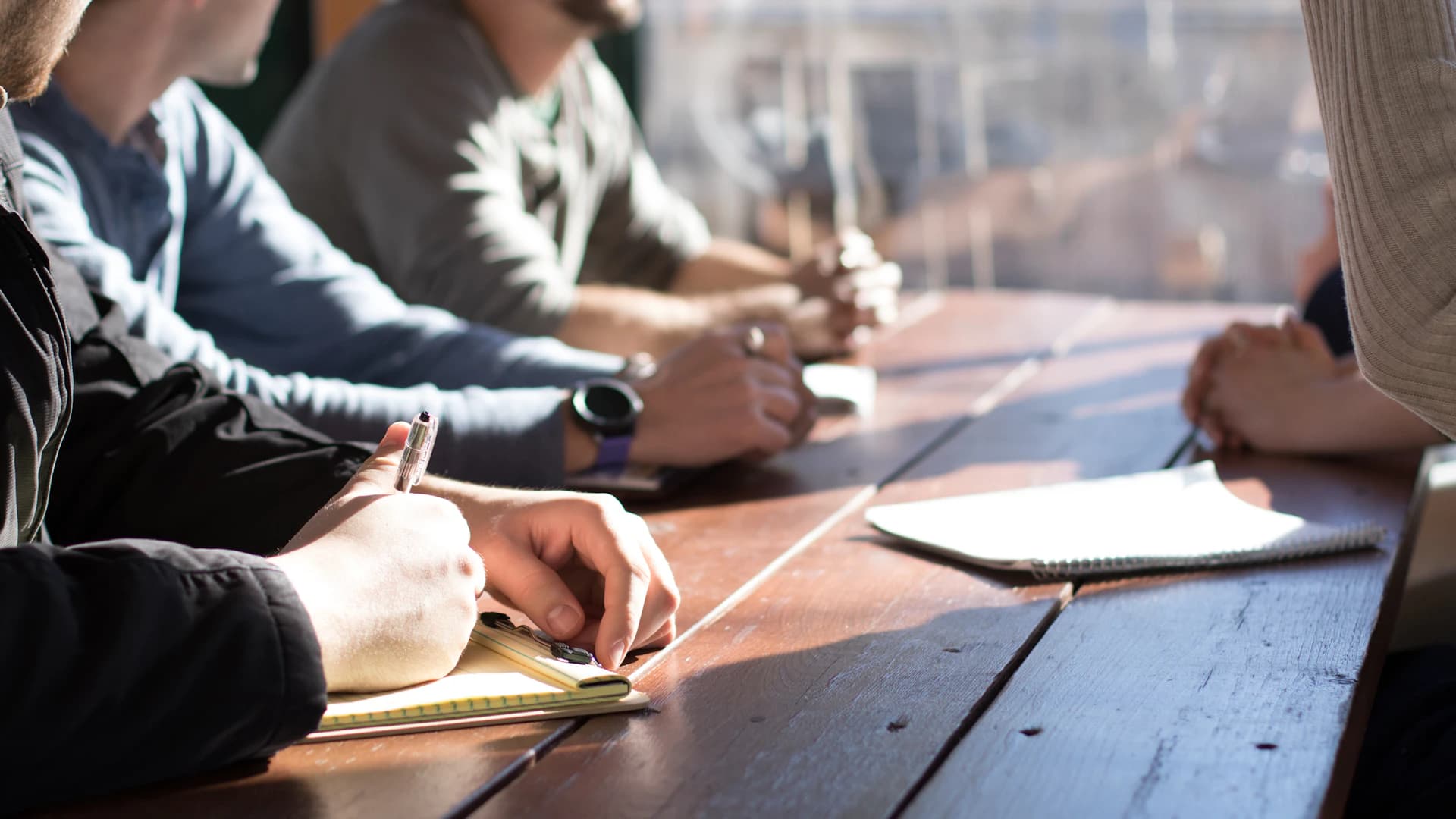 Business consultants collaborating around a planning table