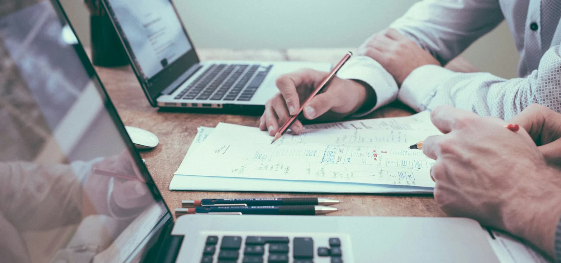 Business leaders reviewing plans with transparency